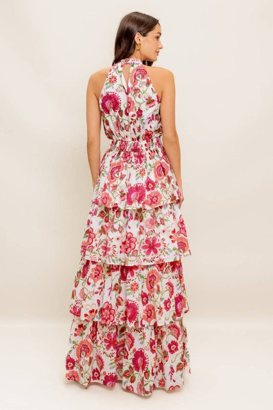 Sleeveless printed woven maxi dress featuring halter neckline, layered skirt and smocked back waistband