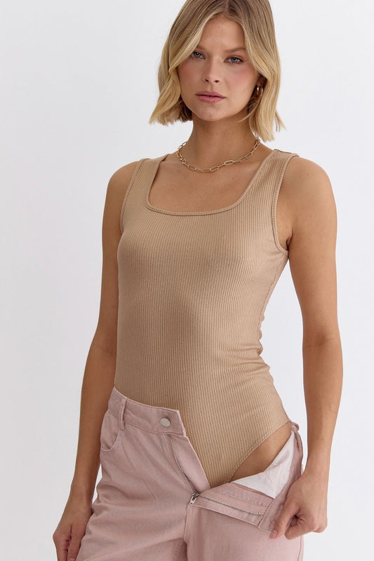 Shimmered u-neck sleeveless bodysuit featuring snap button closure.