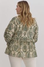 Printed babydoll long sleeve top featuring ruffle detail. Elastic at cuff. Lined. Woven.