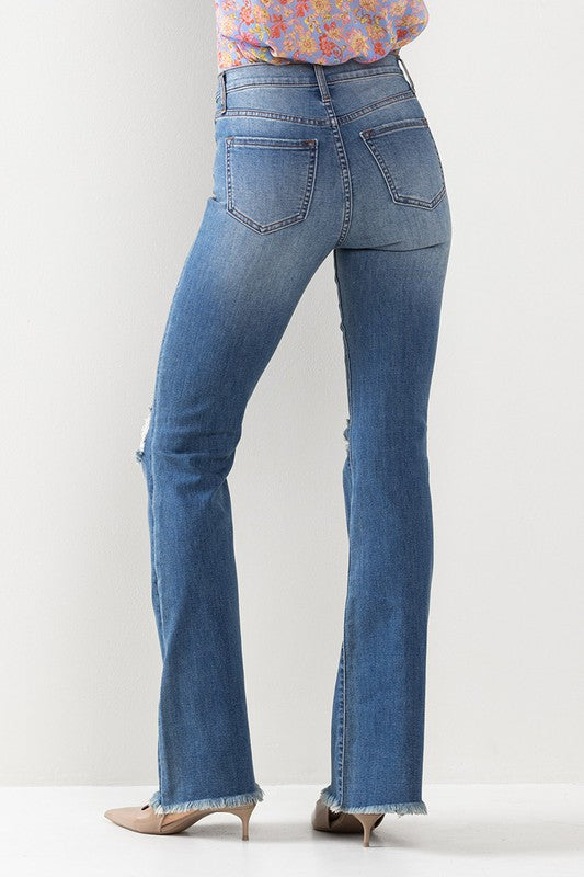 High Rise Bootcut Destressed Jeans with Fray Hem