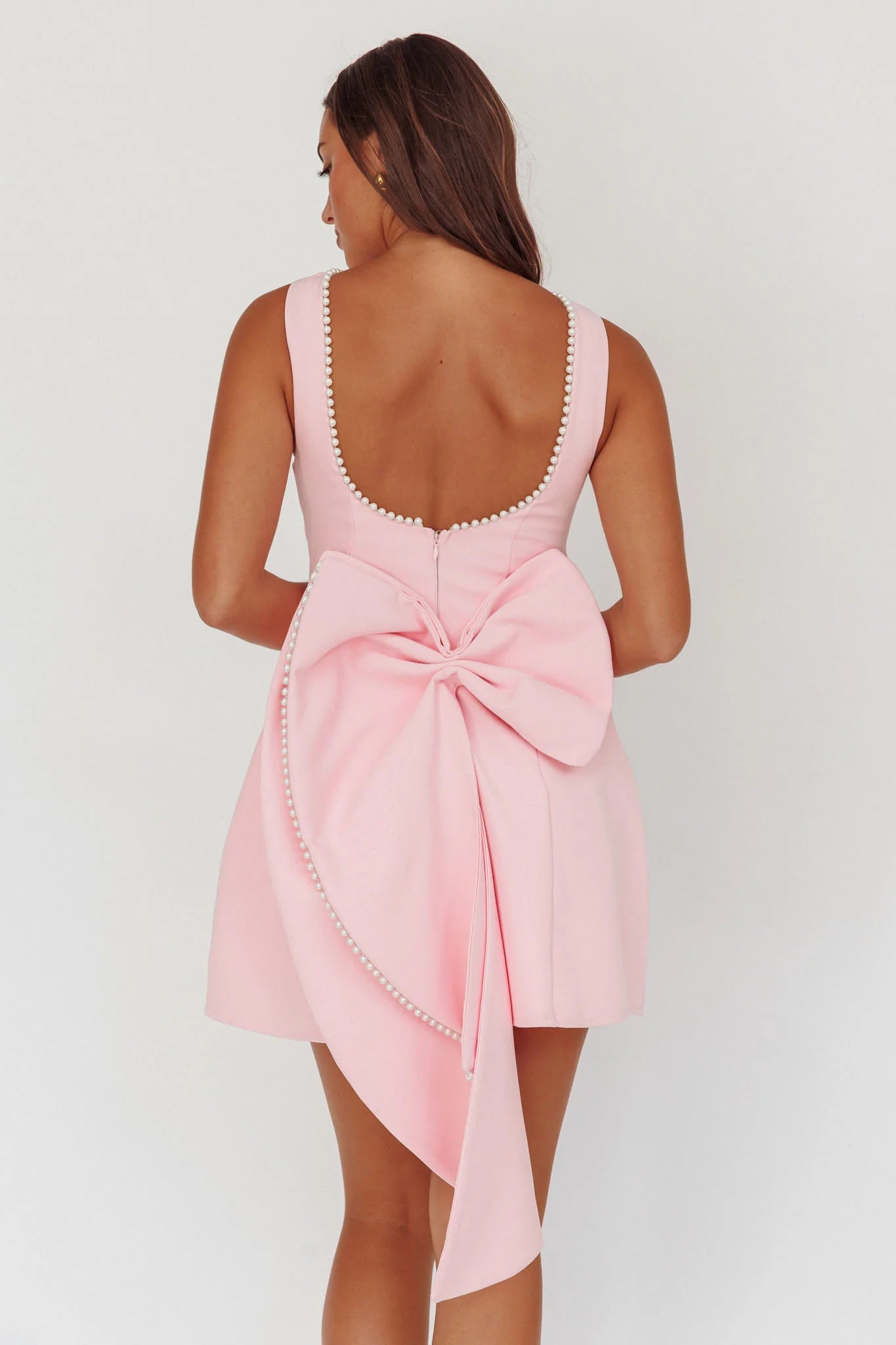 Sleeveless Fit and Flare Mini Dress with Low Back Big Bow and Pearl Accents