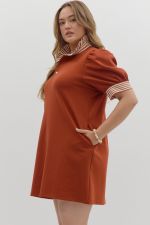 Solid short sleeve pullover polo dress featuring contrasting ruffle neck and sleeve band and pockets