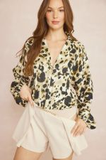 Animal print v-neck collared bodysuit featuring hook and eye closure at bust.