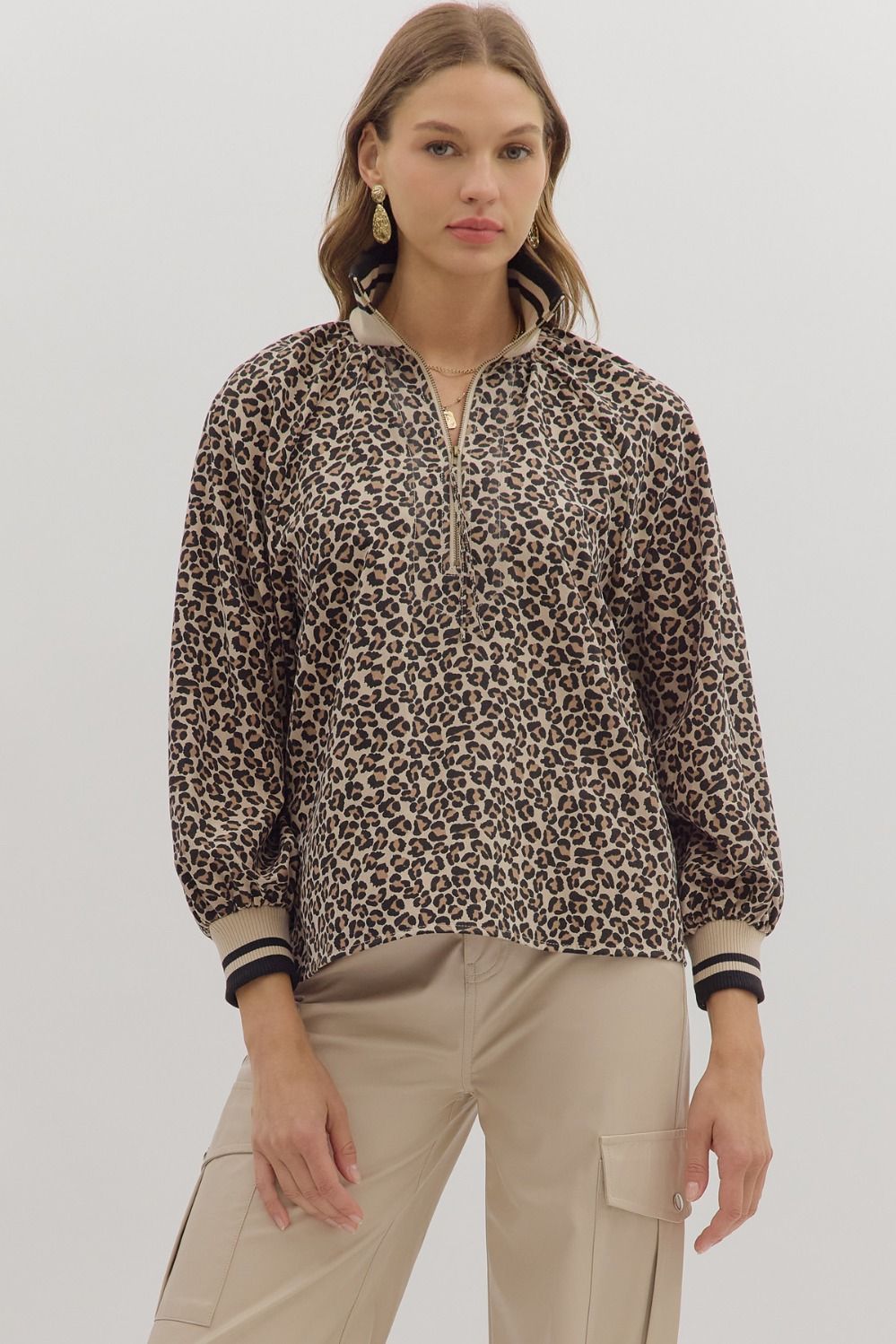 Leopard print long sleeve top featuring zip-up mock neck